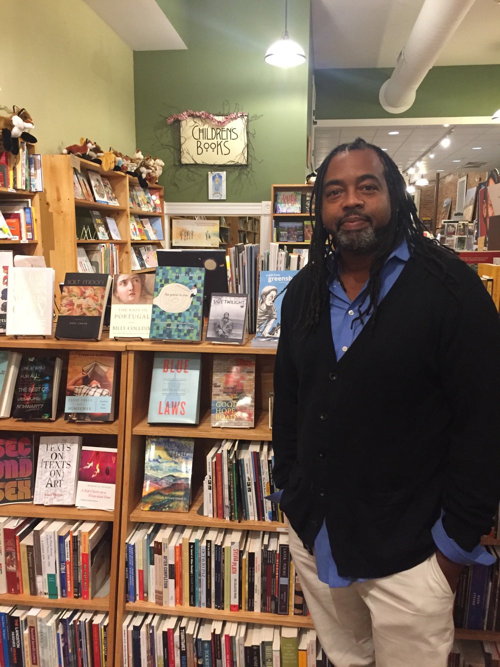 Quraysh Ali Lansana at Scuppernong Books in Greensboro. A Gift from Greensboro is peeking out from behind him. 